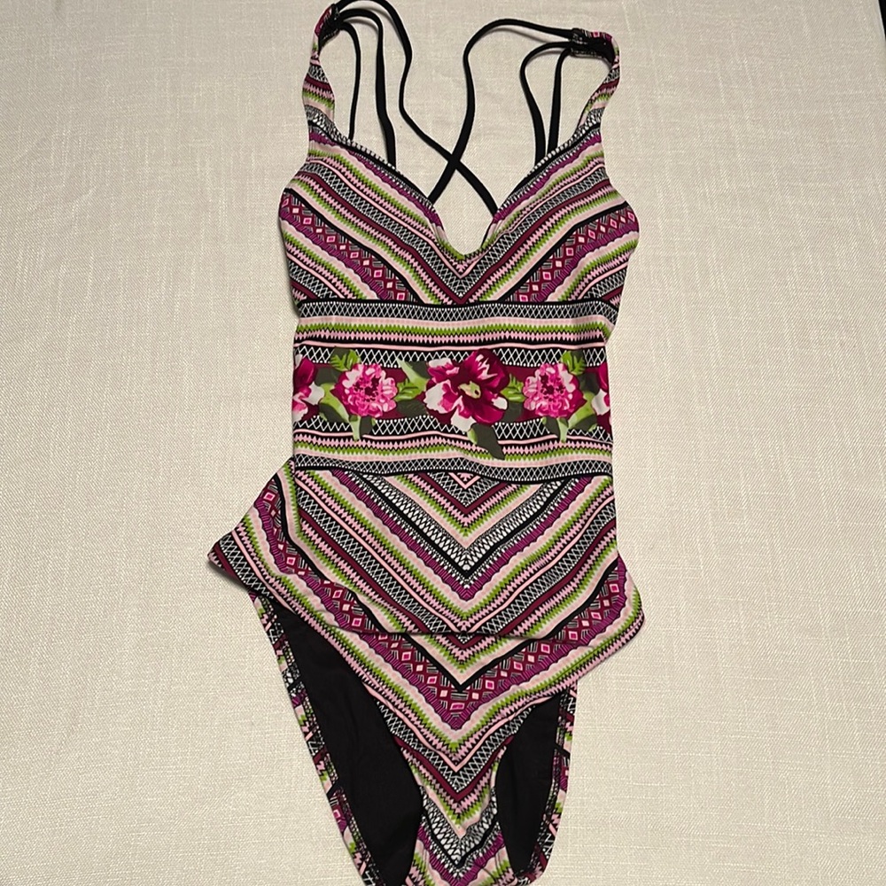 NEW. One piece. Size small